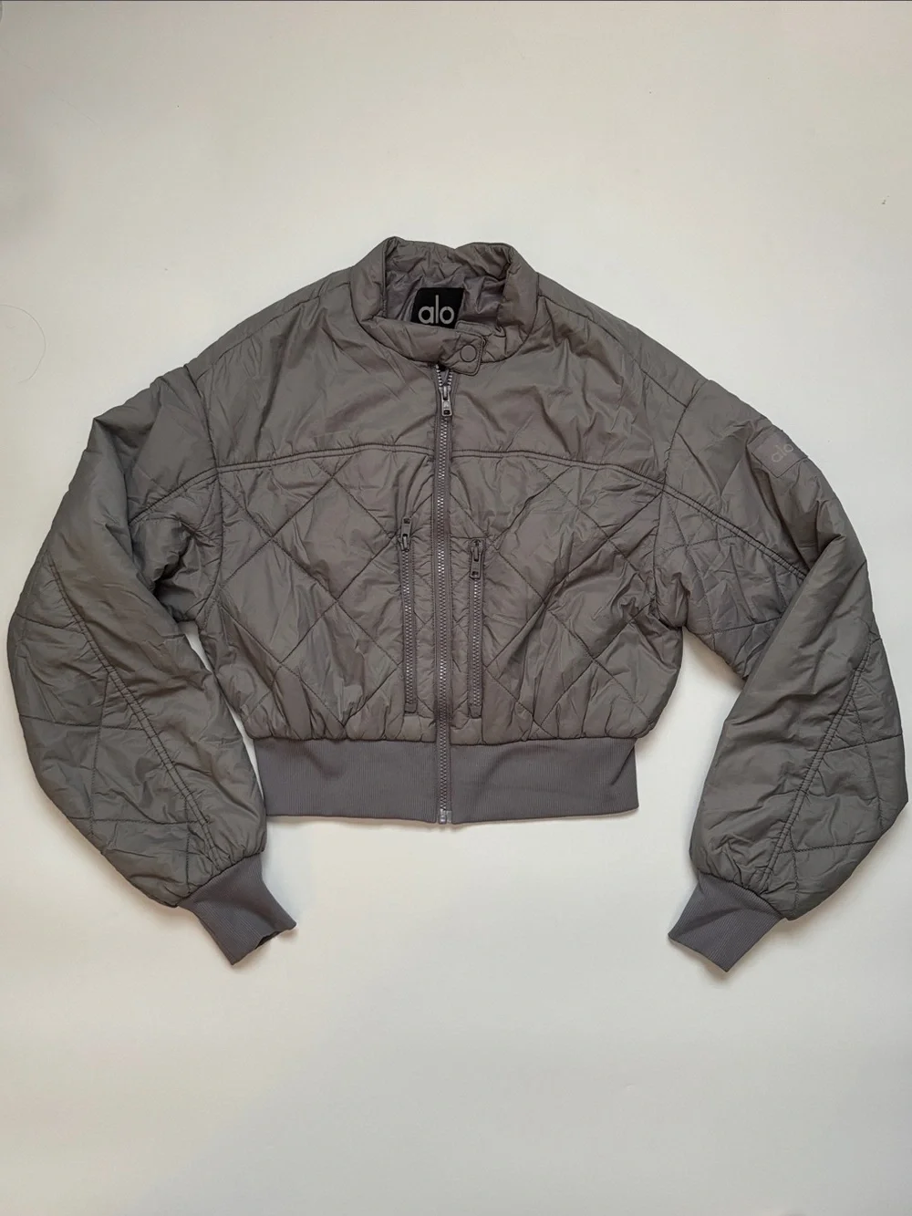 ALO Yoga Quilted Cropped Bomber Jacket in Grey - Picture 1 of 7